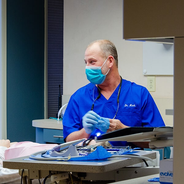 Dr. Sodorff inside the dental office smiling